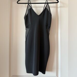 Black mini dress with mess side details. Size 2